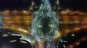 Hyperlapse time-lapse of car traffic transport at roundabout in foggy night