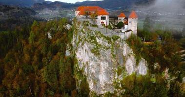Aerial view of Blejski Grad, castle built on top of a rock. Slovenia. video