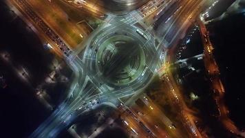 Top down view of car traffic transport at roundabout in foggy night video