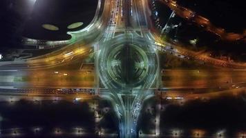 Hyperlapse time-lapse of car traffic transport at roundabout in foggy night video