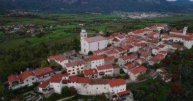 Aerial view of the houses with red roofs, the old town on a hill. Slovenia video