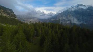 FPV maneuverable flight near the lake Oeschinensee in Swiss Alps, Switzerland. video