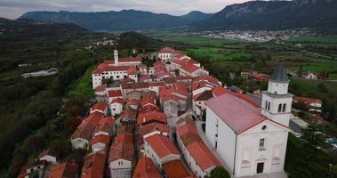 Aerial view of the houses with red roofs, the old town on a hill. Slovenia video