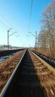 Vertical video. Fast flight over the railway on FPV Drone.