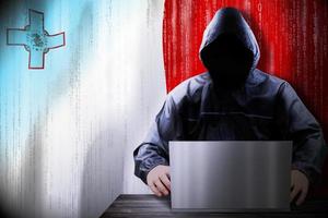 Anonymous Hooded Hacker and Flag Of Malta, Binary Code - Cyber Attack Concept photo
