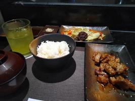 japanese food set with miso soup , green tea and rice with chopstick photo