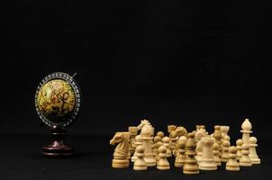Chess figures on black background photo