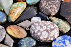 Gemstones on dark background photo