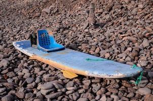 Paddle board on the shore photo