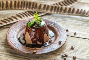 Coffee panna cotta under chocolate topping photo