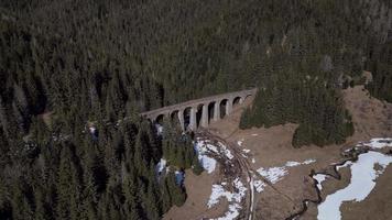 Aerial orbiting view of big viaduct in valley video