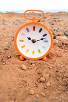 Clock in the sand photo