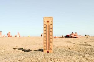 Thermometer in the sand photo