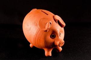 Piggy bank on dark background photo