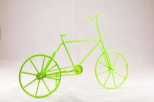 Green bicycle on light background photo