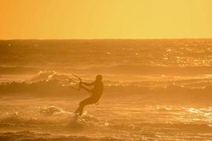 Kitesurfer at sunset photo