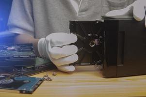 side view Technician installing hard drive photo