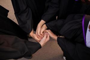 Team that joins hands with each other to symbolize agreement to work be effective and unified of  work team.  background of many hands that join hands together as symbol of work team. photo