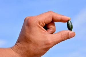 Hand holding a gemstone photo