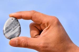 Hand holding a gemstone photo