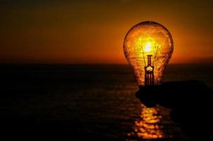 Lightbulb at sunset photo