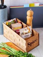 Wooden box for spices, convenient storage at home, order in the house, order in the kitchen concept photo