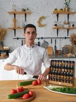 Restaurant chef and a set of jars with different spices in a wooden box in the kitchen. Kazan, 17 March 2023 photo