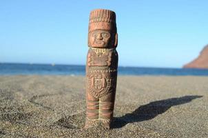 Statue in the sand photo