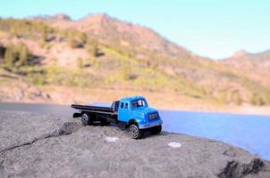 Toy truck on a rock photo
