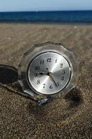 Clock in the sand photo
