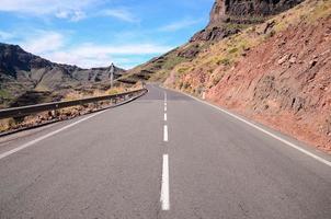 Road through the scenic landscape photo