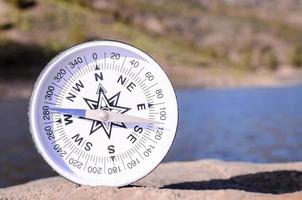 Compass on a rock photo