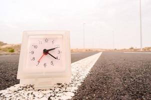 Clock on the road photo