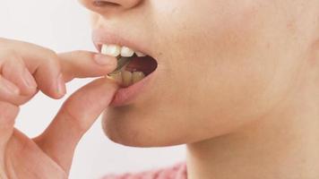 Close-up of woman eating sunflower seeds. The woman is eating seeds. video