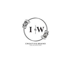 initial IW letters hand drawn feminine and floral botanical logo suitable for spa salon skin hair beauty boutique and cosmetic company. vector