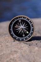 Compass on a rock photo