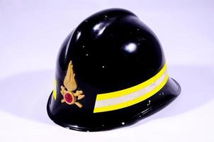 Firefighter helmet on light background photo