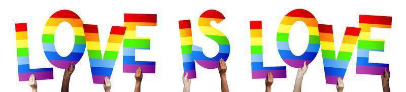 Love is Love, Lgbt Banner - Human Hands Holding Colorful Letters photo