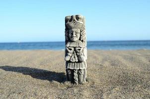 Statue in the sand photo