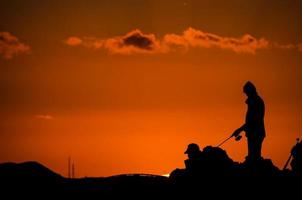 Fishing at sunset photo