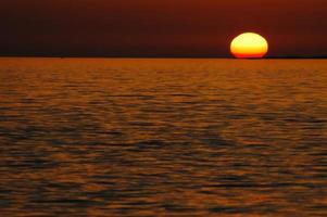 Sunset over the sea photo