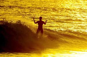 Surfing in the ocean photo