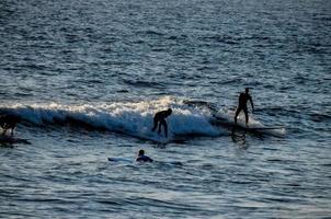 Surfing in the ocean photo