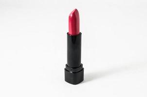 Red lipstick on light background photo