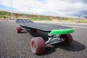 Skateboard on the sidewalk photo