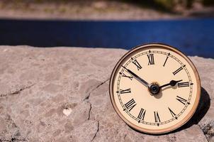 Clock on a rock photo