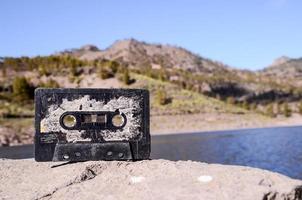 Old cassette tape on a rock photo