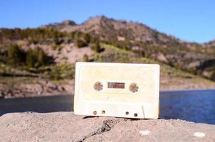 Old cassette tape on a rock photo