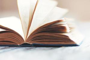 old weathered book with open pages in retro style photo