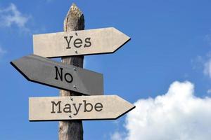 Yes, No, Maybe - Wooden Signpost with Three Arrows, Sky with Clouds photo